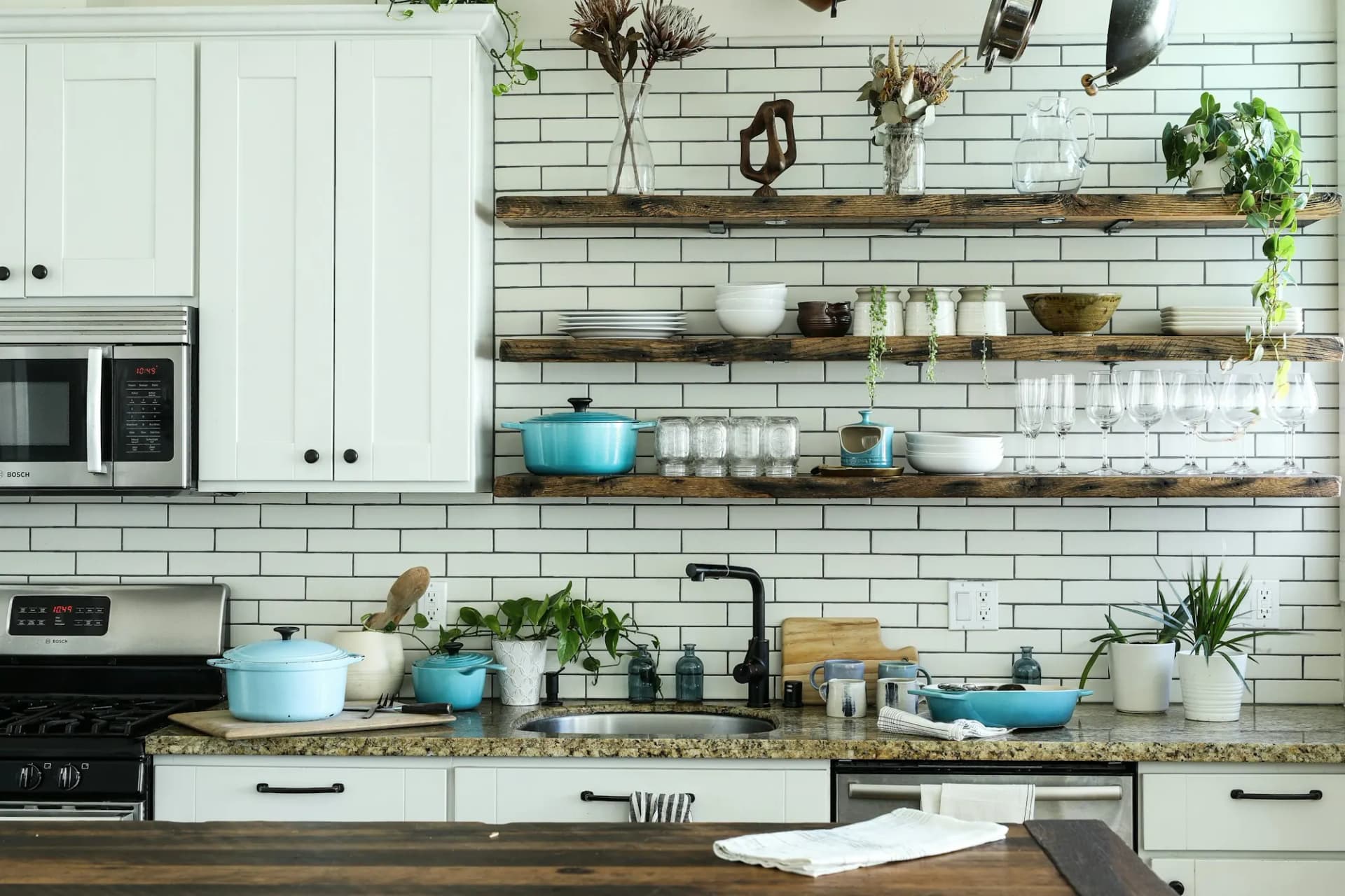 Two people cooking together in a bright kitchen