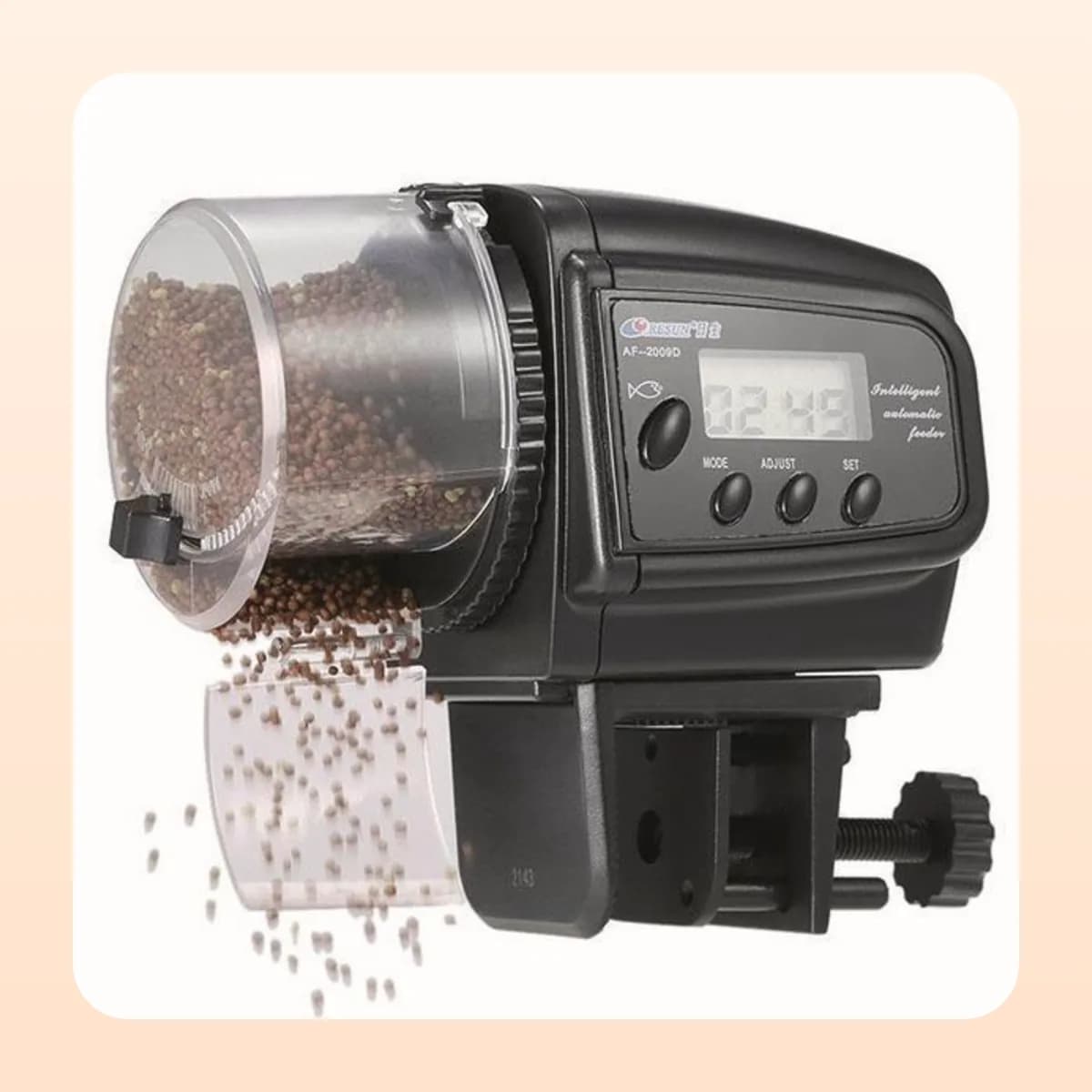 The Kindral timer feeder dispensing food into a tank