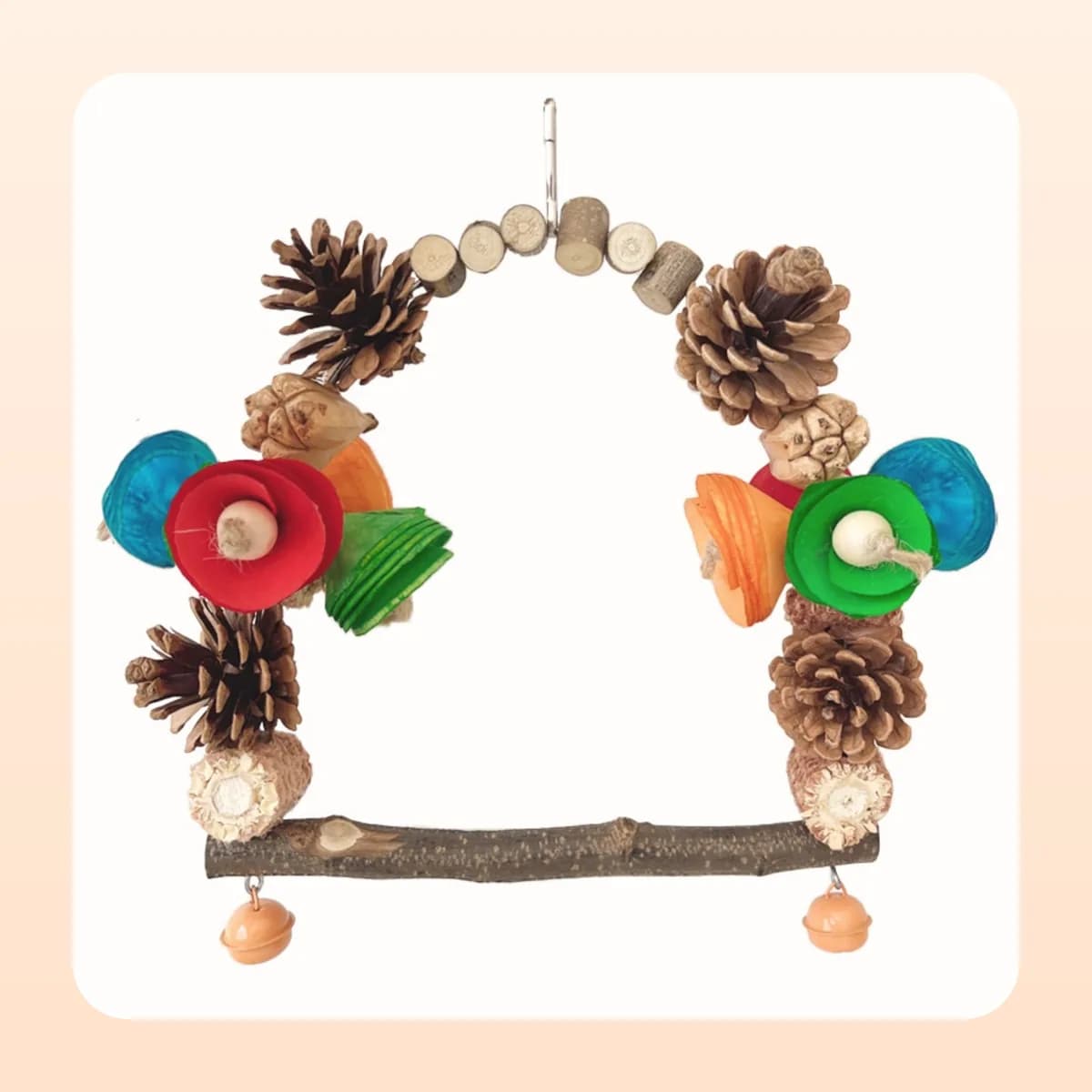 The Kindral pine cone swing hanging in a cage