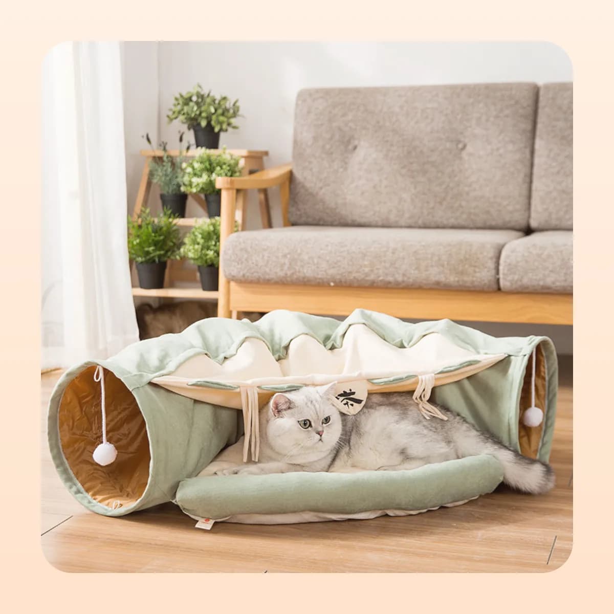 Cat asleep in the Kindral tunnel bed in a living room