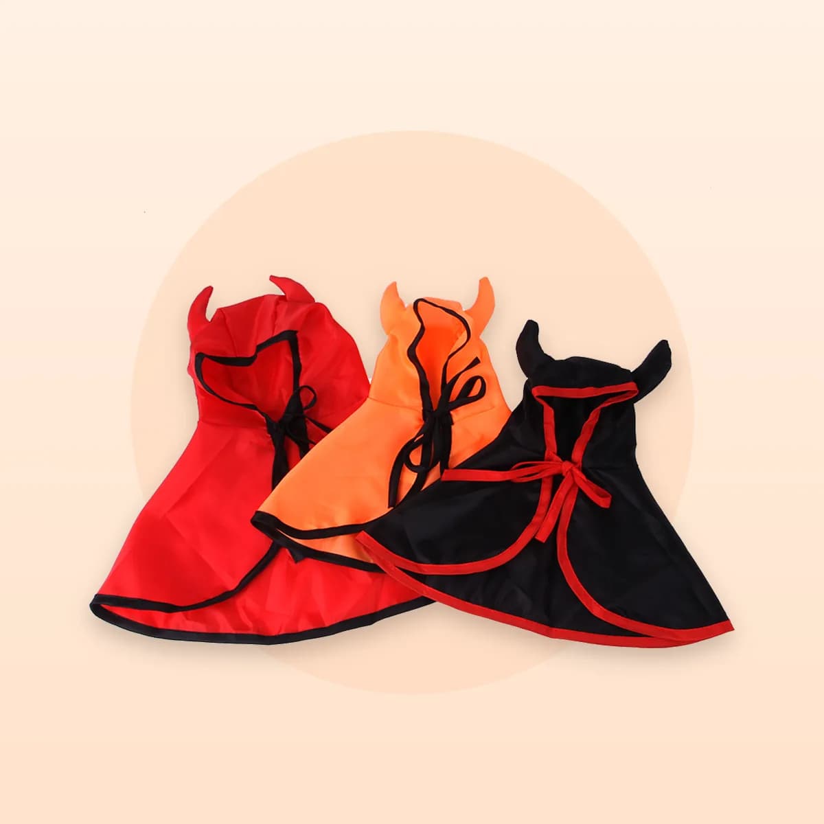 All three colourways of the Kindral horned hooded cape