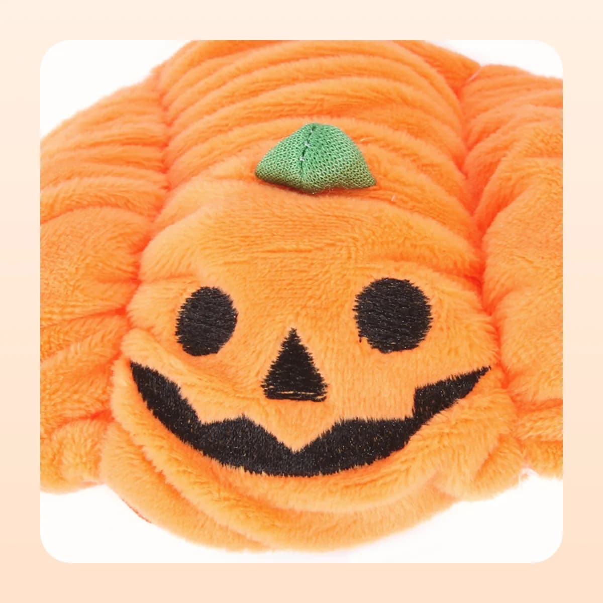 Close view of the stitched face on the Kindral pumpkin hood