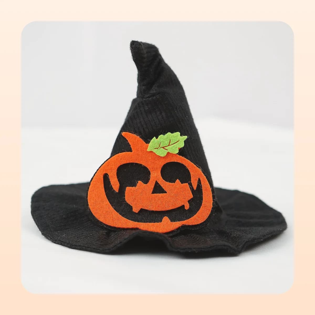 Kindral pointed witch hat with the large pumpkin appliqué