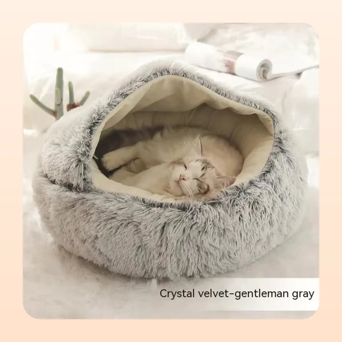 Cat asleep in the Kindral crystal velvet burrow bed in grey