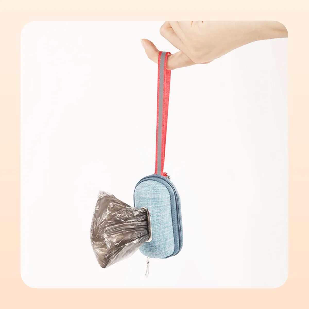 Kindral poop bag dispenser held by its reflective strap