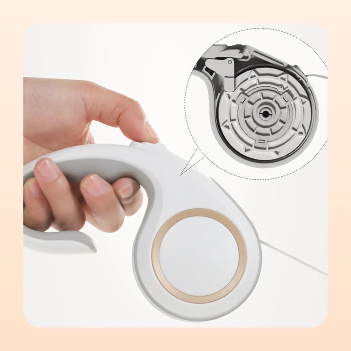 Thumb on the lock button, with the internal spool shown