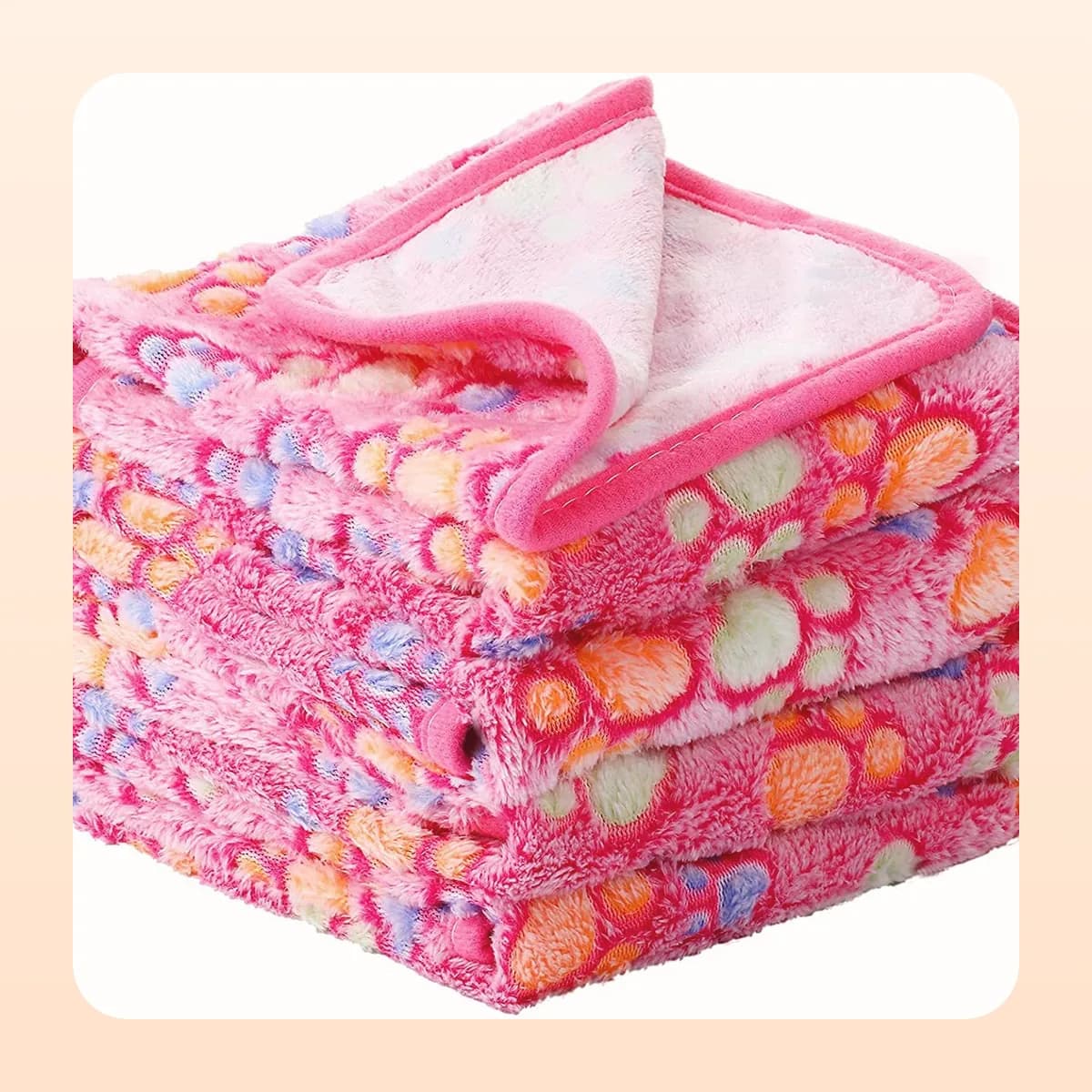 Kindral paw-print fleece blanket in pink