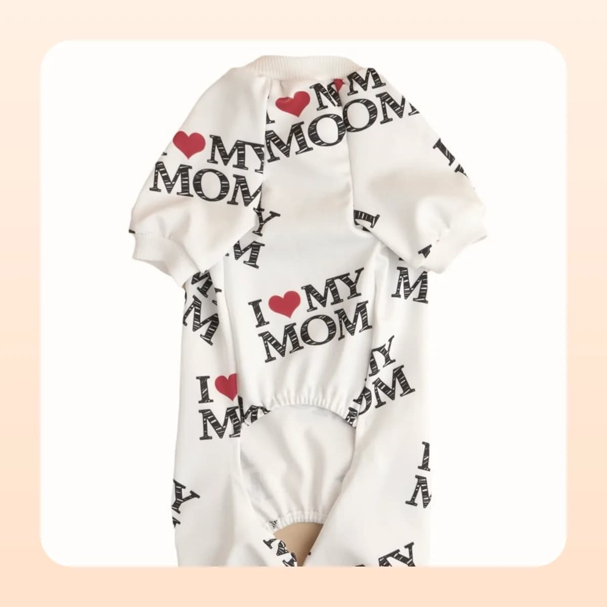 Kindral white pyjama suit shown flat from the front