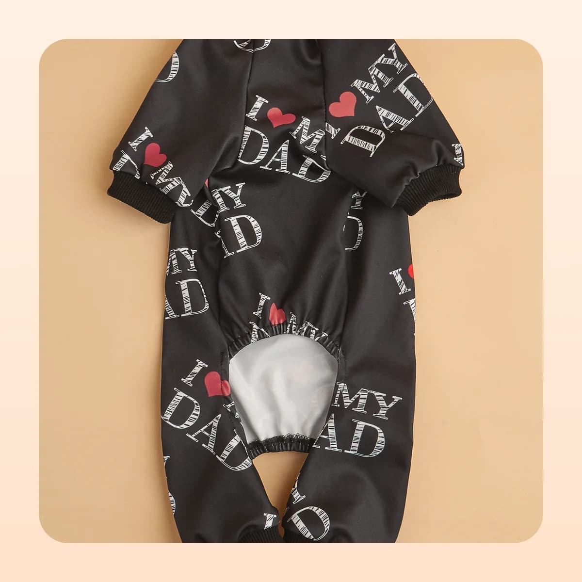 Kindral black pyjama suit shown flat from the back
