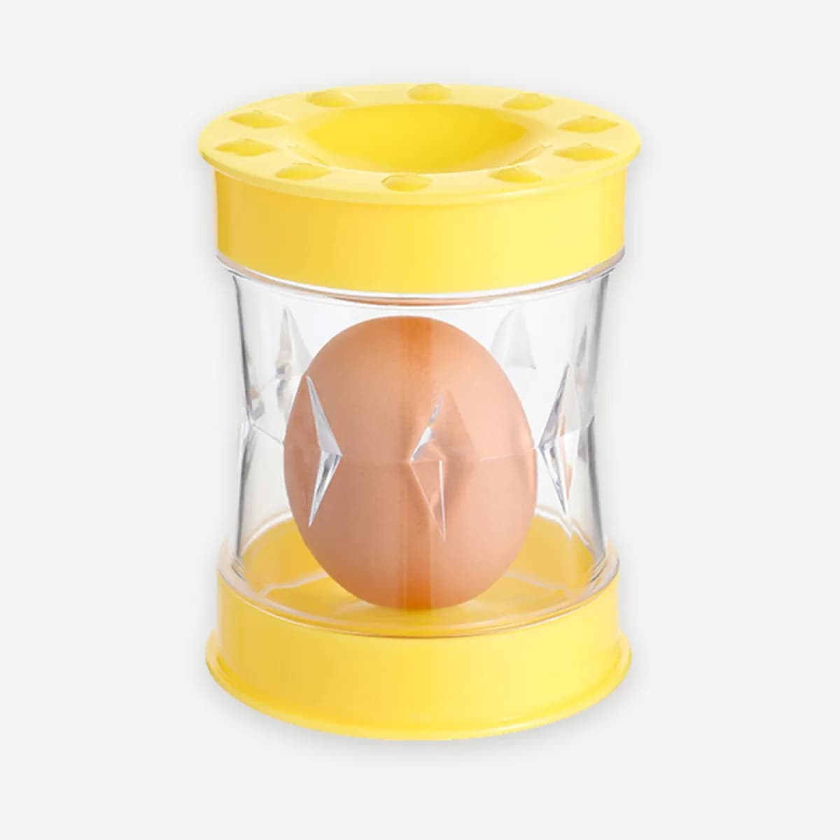 Kindral shake egg peeler in yellow with an egg inside