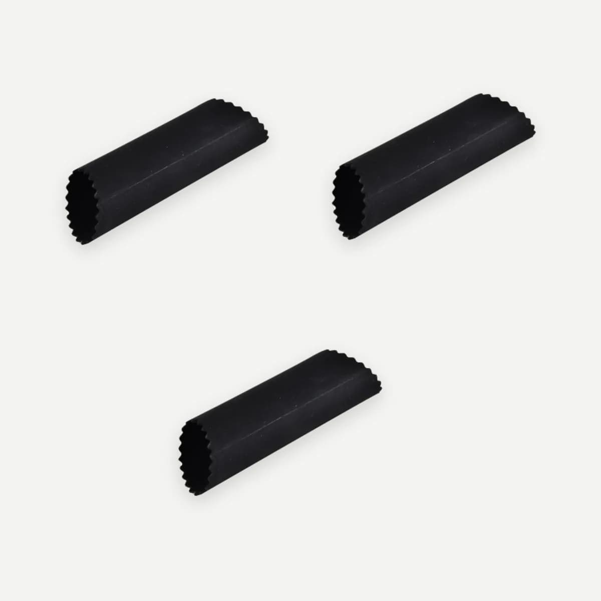 Kindral silicone garlic peeler in black, set of three