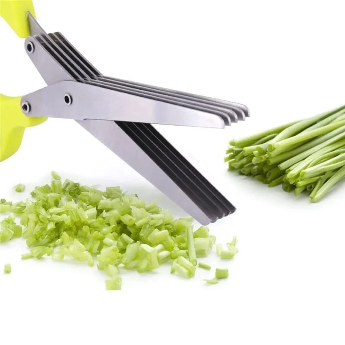 Kindral 5-blade herb scissors in green beside chopped spring onion