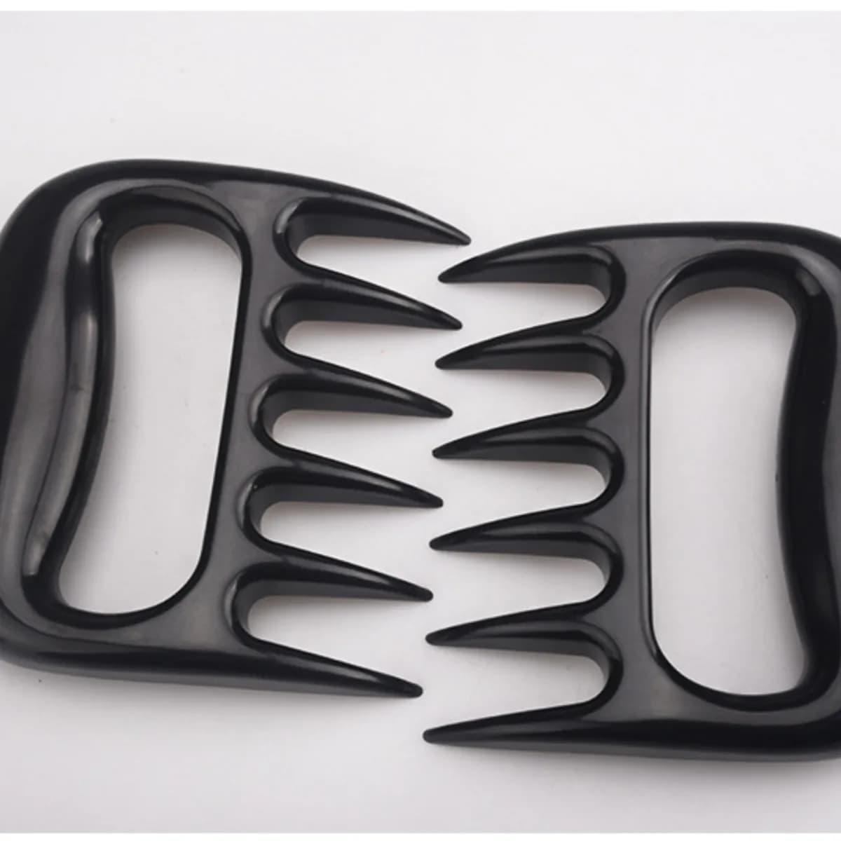 Kindral meat claws in black, a pair laid flat