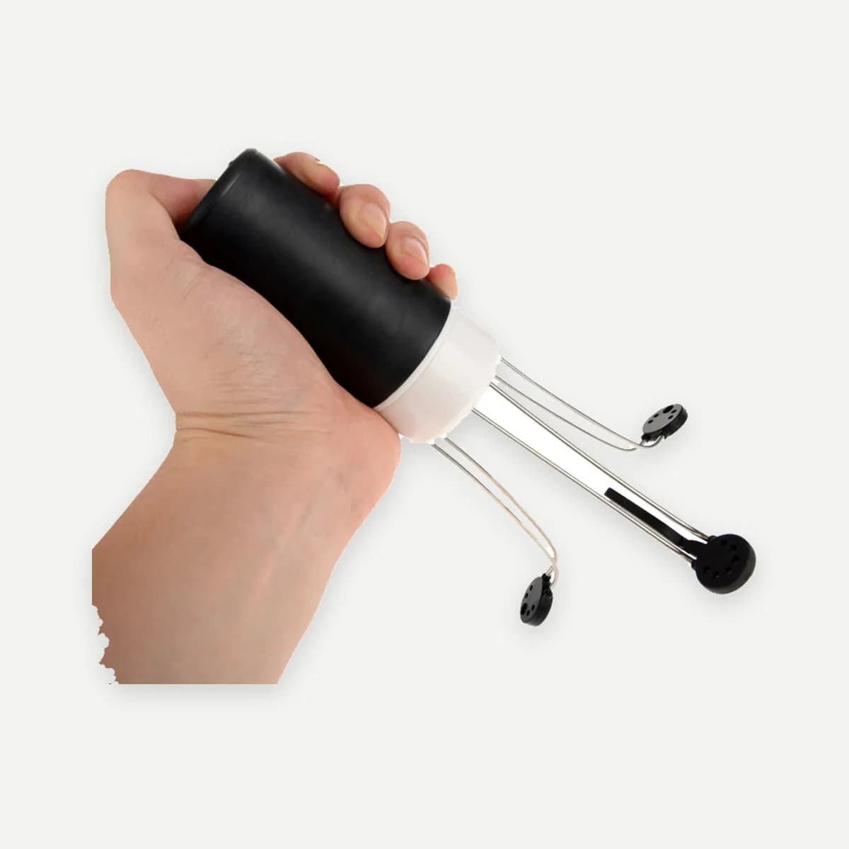 Kindral automatic pot stirrer in black, held in one hand